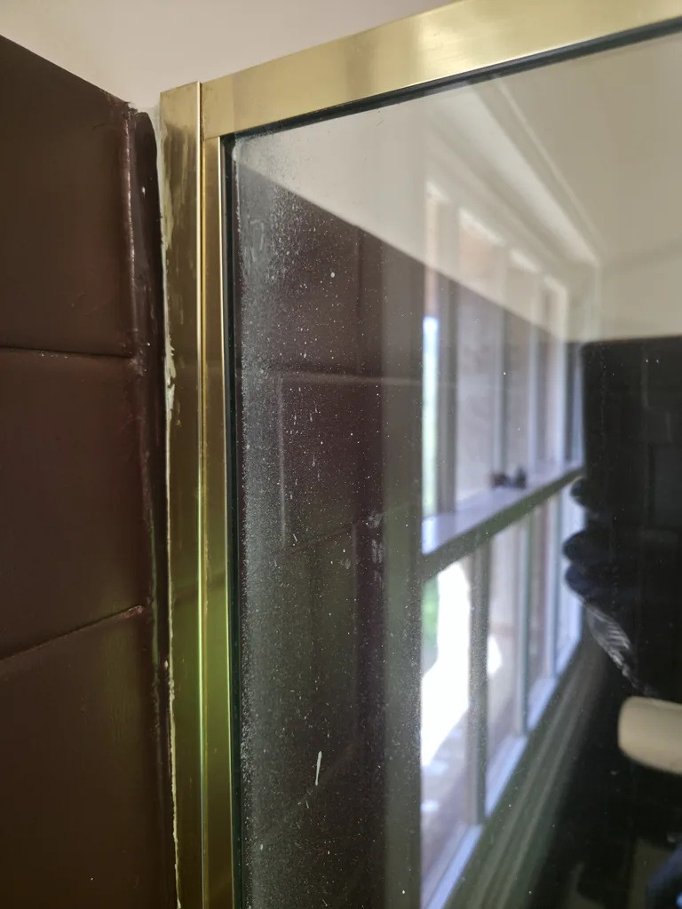 Surface film on the shower screen before cleaning