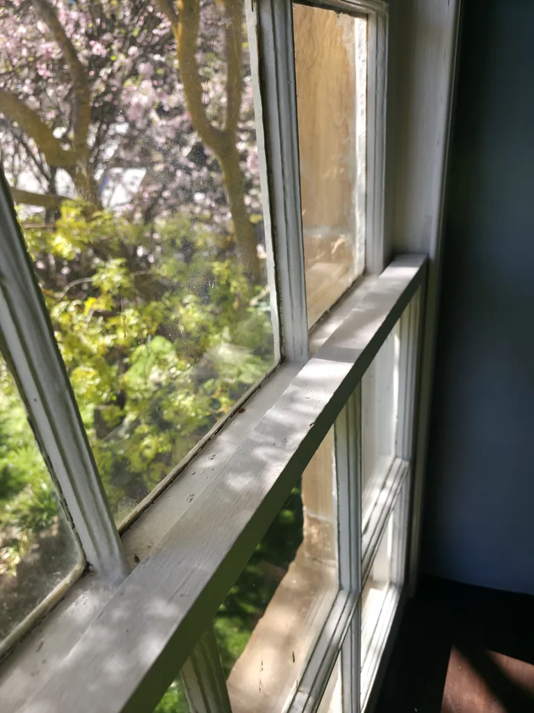 Dust and residue on a house window frame before cleaning