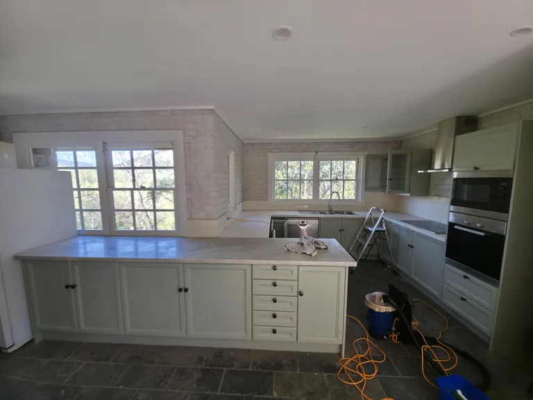 Kitchen cleaning in progress at Stonefield Estate for Abode Restoration