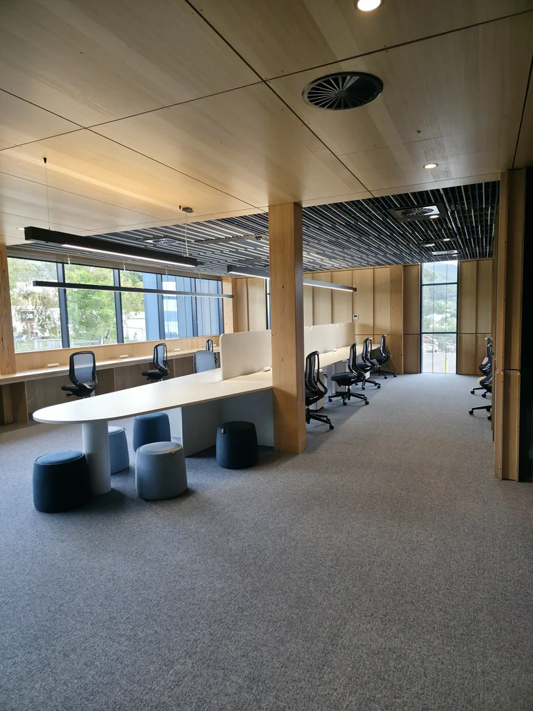 Shared seating and window-side benches in the Level 1 workspace