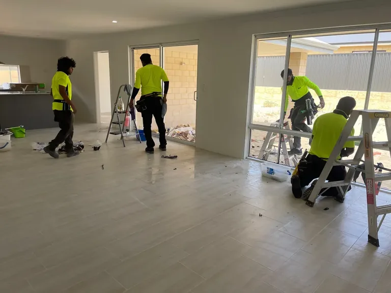 Zavvers crew cleaning floors and glazing in a newly built Perth home